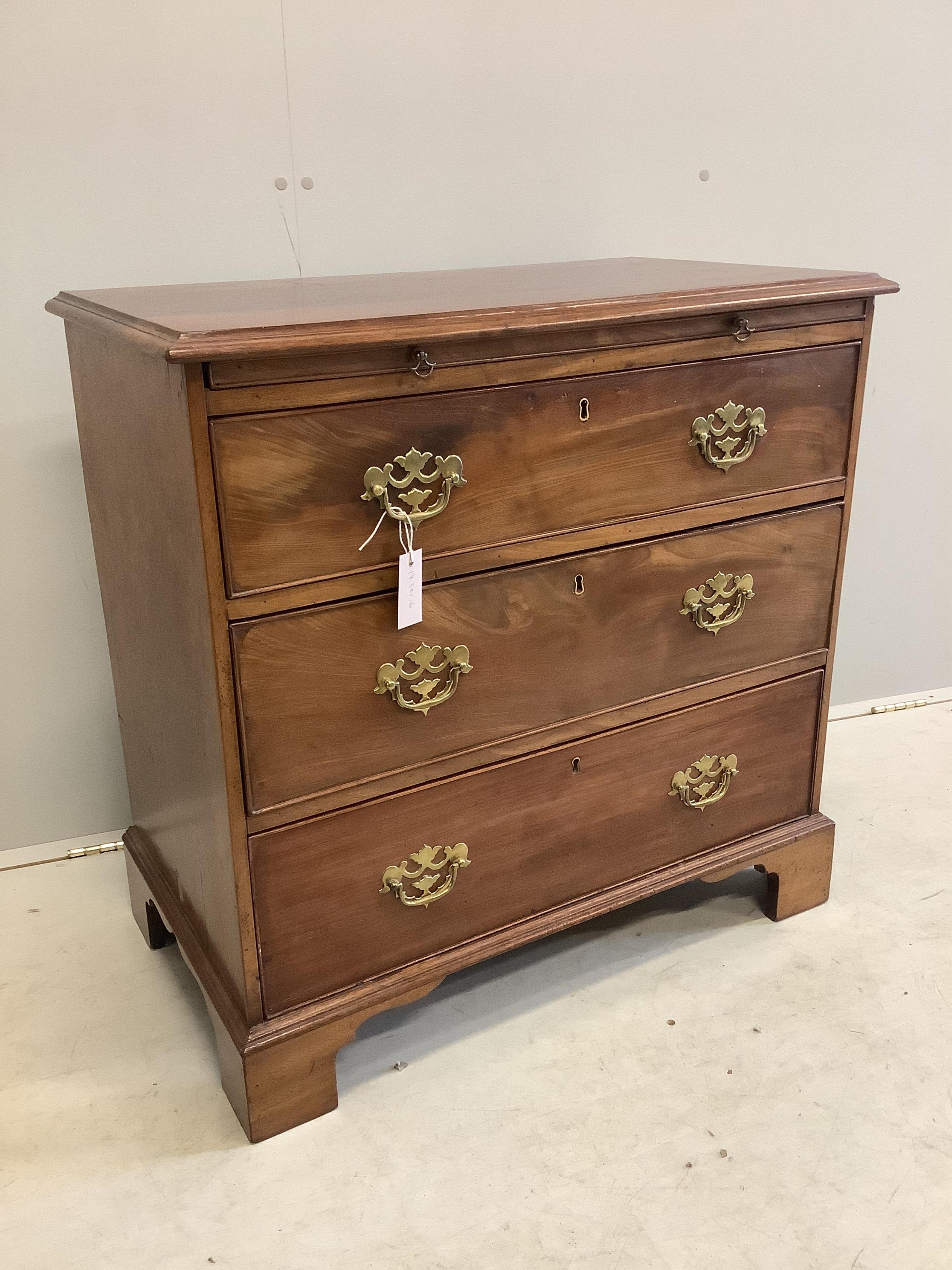 A small George III and later mahogany chest of drawers with a brushing slide, width 80cm, depth 45cm, height 79cm. Condition - fair